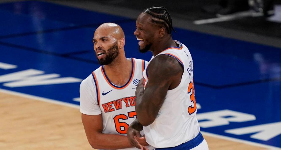 GIbson (L) and Randle embrace after a win 2021